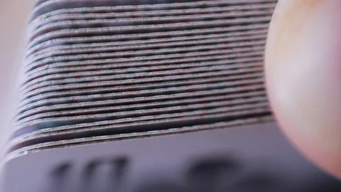 Thumbing through playing cards/macro focus 스톡 동영상 93336787
