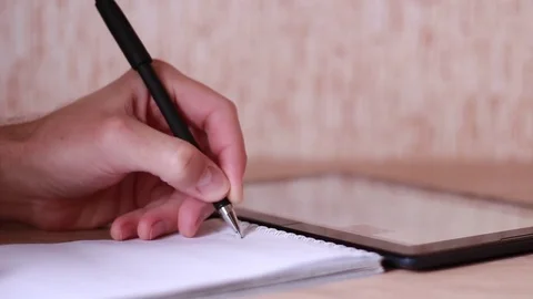 Thumbing through the tablet and making outline Video stock 83747719