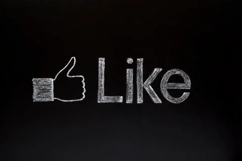 Thumbs up on blackboard Stock Photos