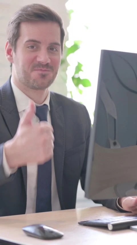 Thumbs Up by Businessman while Using Desktop Computer, vertical video Stock Footage 328977567