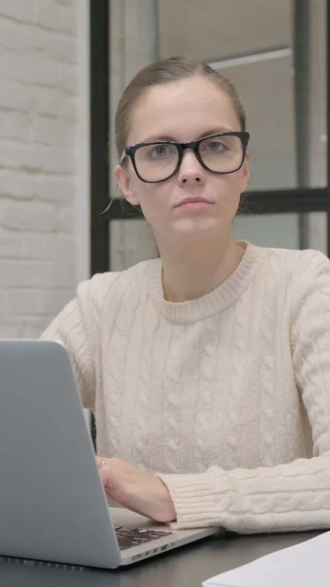 Thumbs Up by Creative Woman Using Laptop, vertical video Stock Footage 325831558