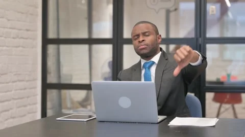 Thumbs Down by African Businessman Using Laptop Video stock 301286921