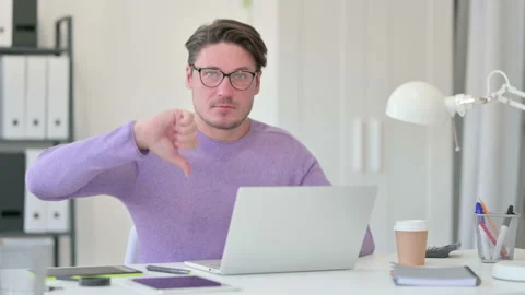 Thumbs Down by Creative Middle Aged Man with Laptop 스톡 동영상 143562509