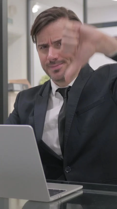 Thumbs Down by Middle Aged Businessman at Work, vertical video Stock Footage 325568663