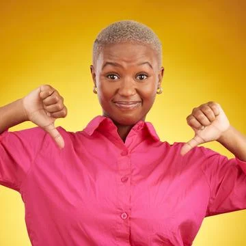 Thumbs down, portrait and black woman in studio with no, bad or negative Stock Photos