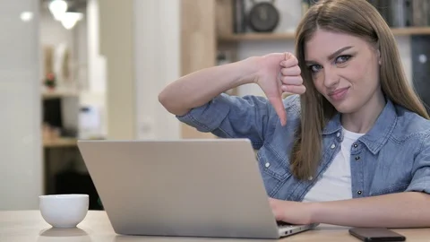 Thumbs Down by Young Girl at Work Video stock 100659756