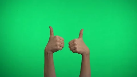 Thumbs up on a green background. Stock Footage