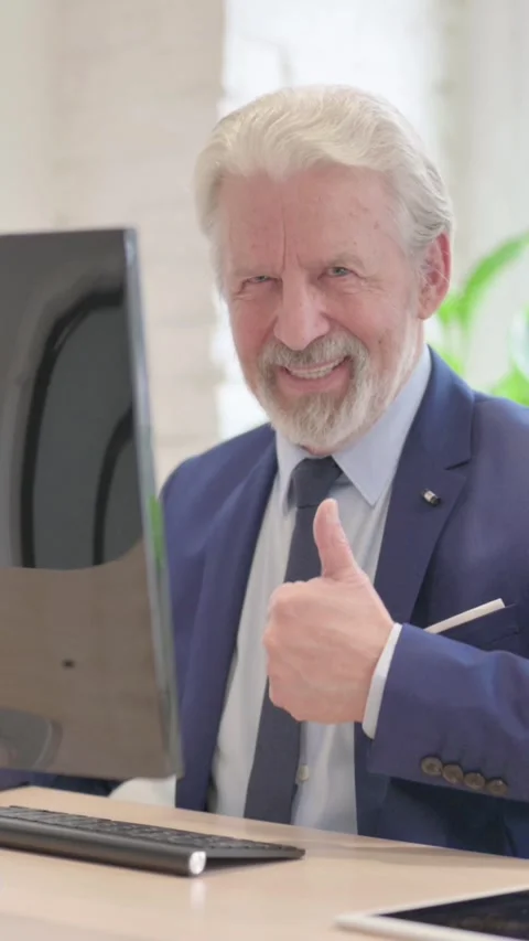 Thumbs Up by Senior Old Businessman while Using Desktop Computer, vertical video Stock Footage 328974425