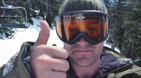 Thumbs Up on the Ski Lift Stock Footage 665262