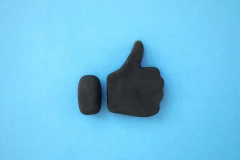 Thumbs up symbol. 3d icon shape of black thumb up sign on blue background. Co Stock Illustration
