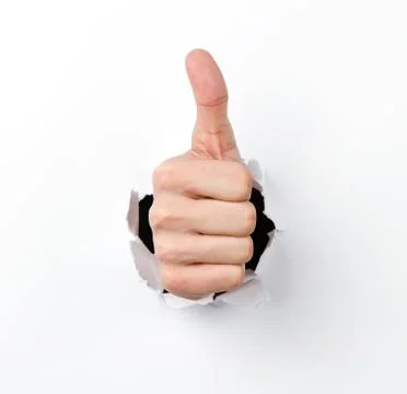 Thumbs up through the hole Stock Photos