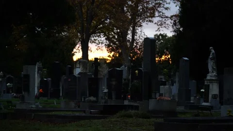 Thumbstones in front of sinking sun Stock Footage 145810909