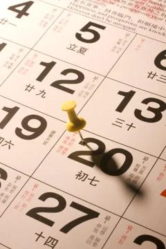 Thumbtack on calendar Stock Photos