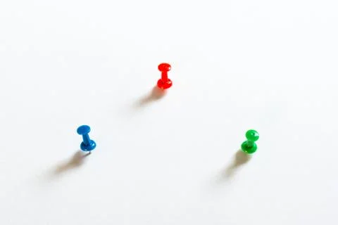 Thumbtack pins on white Stock Photos