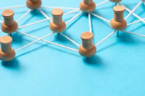 Thumbtacks with strings represents social or people networking Stock Photos