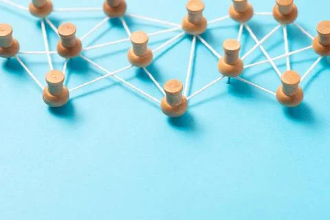 Thumbtacks with strings represents social or people networking Stock Photos