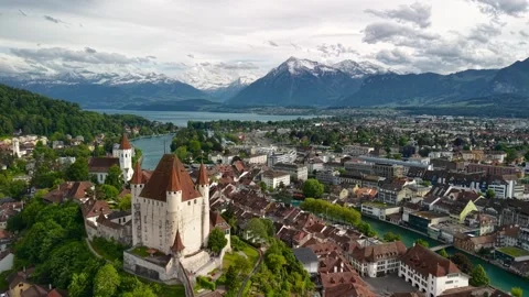 Thun Castle overlooking the historic town and snow capped alps Stock Footage 340952311