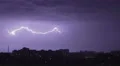 Thunder and lightning above city sky. Lightning forks to buildings, sound 4k or 4k+ Resolution