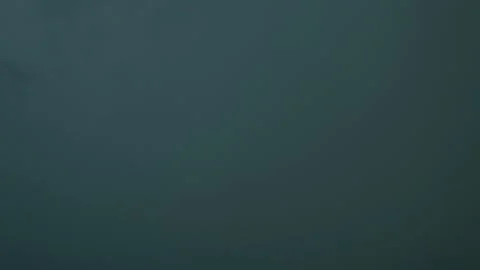 Thunder and lightning in the dark overcast sky.  Stock Footage 136756633