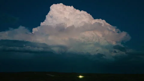 Thunder and lightning display in beautiful twilight storm over country road Stock Footage 313307786