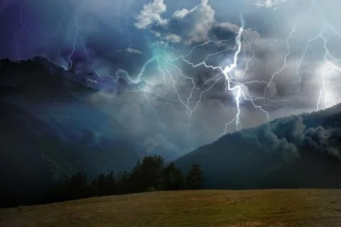 Thunder cloud with lightnings over mountains. Severe weather Stock Photos
