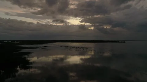 Thunder clouds above the lake in Siberia Video stock 281192885