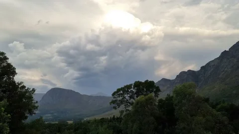 Thunder Clouds And Sunset Colors Over Mountains Stock Footage 168945001
