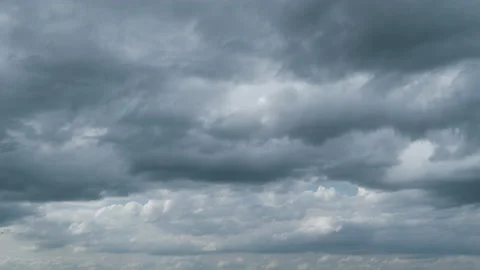Thunder clouds before or after rain time. Dark storm clouds change shape Stock Footage 212502365