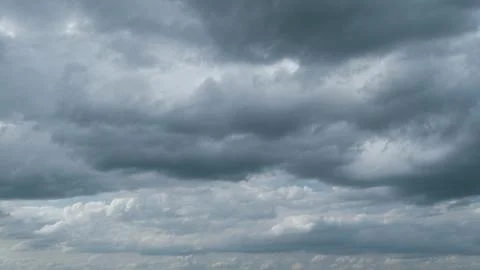 Thunder clouds before or after rain time. Dark storm clouds change shape Stock Photos