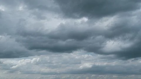 Thunder clouds before or after rain time. Dark storm clouds change shape Stock Photos
