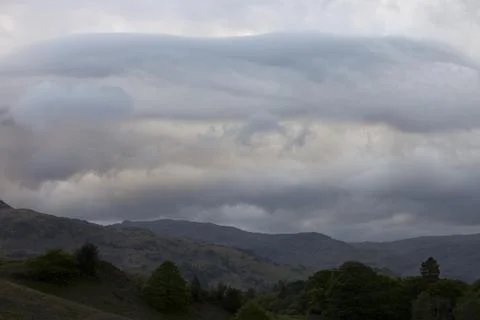 Thunder storm clouds over the Lake District mountains, Cumbria, UK Фото