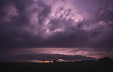 Thunder storm clouds with roll cloud, summer night, Lithuania Stock Photos
