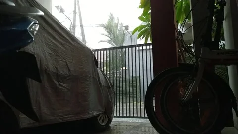 Thunder storm hard rain seen from inside house terrace  Video stock 162614754