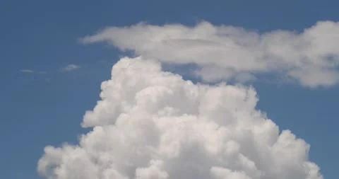 Thunder storm time lapse builds under blue sky Stock Footage 137545097