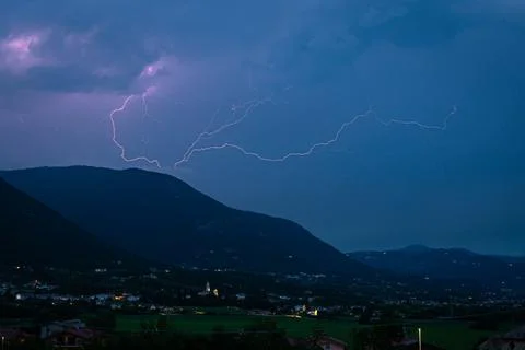 Thunderbolt of lightning over the mountains Stock Photos