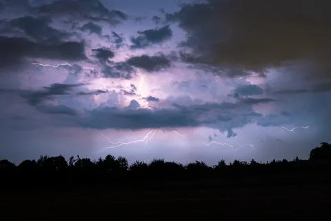 Thunderbolt of lightning from a  storm cloud Stock Photos