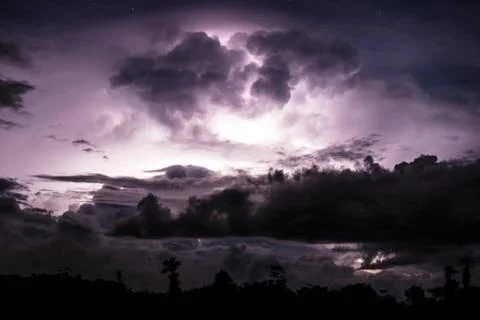 Thundercloud illuminated by lightning Stock Photos