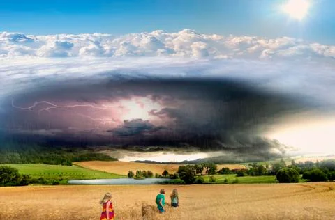 Thundercloud, lightning and rain above the pond and wheat fields Foto stock