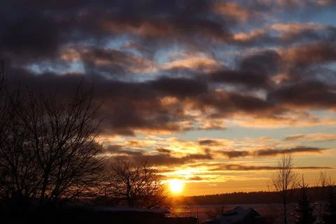 Thunderclouds against the background of the sunset sky, sun rays, silhouett.. Stock Photos
