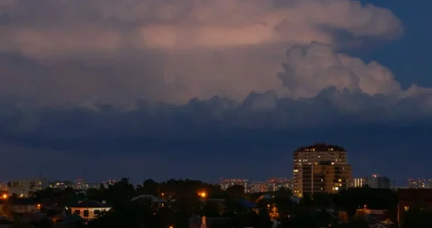 Thunderclouds and lightning over the evening cityscape Video stock 161334510