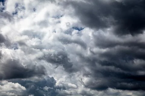 Thunderclouds on the blue sky Stock Photos