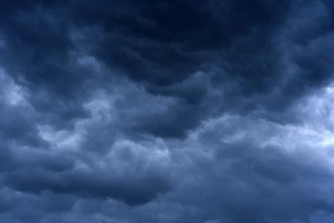 Thunderclouds in the evening sky. Cumulative clouds in a storm. Stock Photos