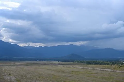 Thunderclouds floating over the valley and mountains Stock-Fotos