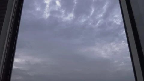 Thunderclouds fly in the sky outside the window Stock Footage 107795389