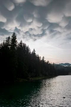 Thunderclouds over the Eibsee lake mammoth clouds bad weather dramatic cloud Stock Photos