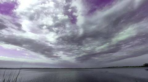 Thunderclouds over the lake Stock Photos
