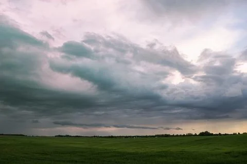 Thunderclouds over the meadows. Scenery. Before the rain. Weather conditions, Stock Photos