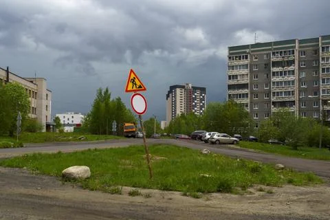Thunderclouds over a poor sleeping district and dirt crossroads of city 스톡 사진