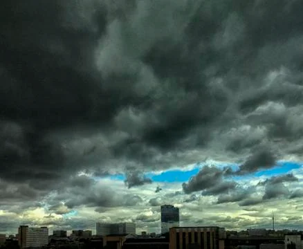 Thunderclouds in the sky over the city. Stock Photos