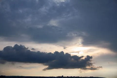 Thunderclouds with sunbeam Stock Photos